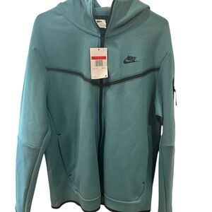 Nike Tech fleece hoodie teal Blue Jacket with Black Details.